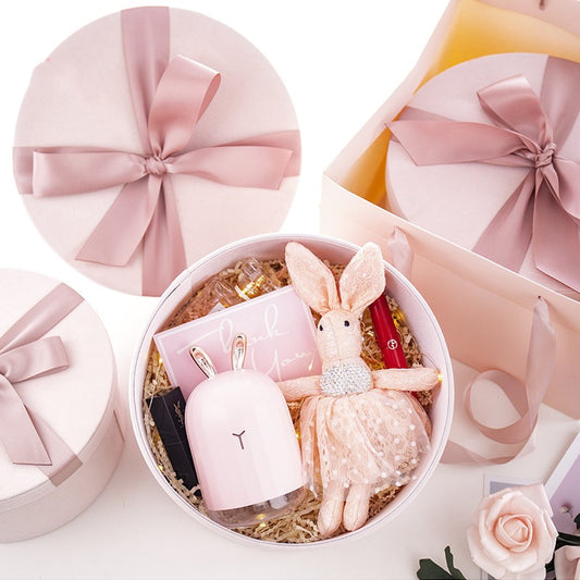 Boîte cadeau ronde en velours avec ruban