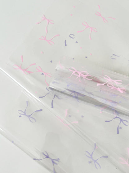 20 feuilles de papier cellophane transparent à motif nœuds (57x57cm)