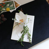 Load image into Gallery viewer, Cascading White Orchid Boutonniere for Groom