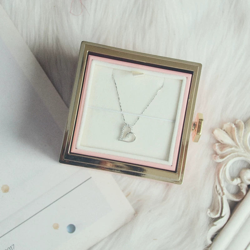 Boîte à bijoux rotative à 360° en velours avec rose éternelle