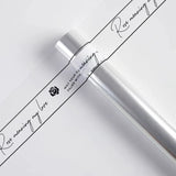 Load image into Gallery viewer, Bordered Transparent Cellophane Roll (57cmx10Yd)