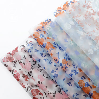 20 feuilles de papier cadeau cellophane à motif floral rose (58x58 cm)