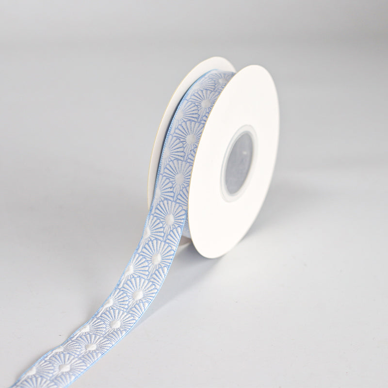 55121 - 25mm White ribbed ribbon with a colourful floral printed