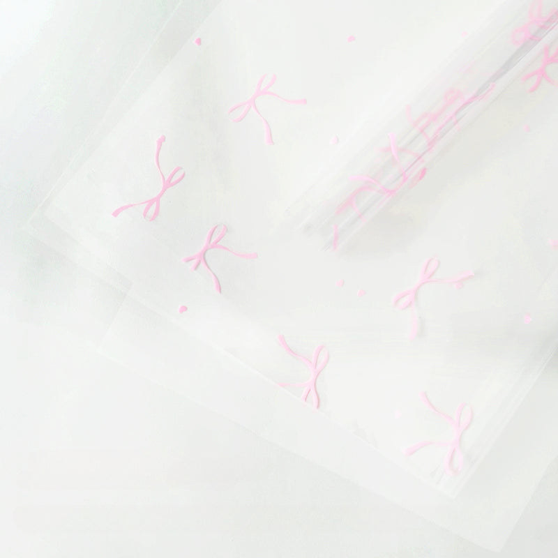 20 feuilles de papier cellophane transparent à motif nœuds (57x57cm)