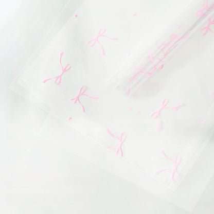 20 feuilles de papier cellophane transparent à motif nœuds (57x57cm)