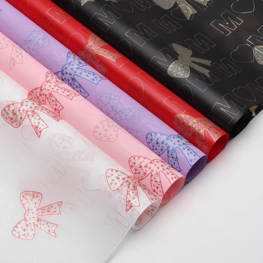 20 feuilles de papier cellophane pour bouquet à motif fleurs et nœuds (57x57 cm)