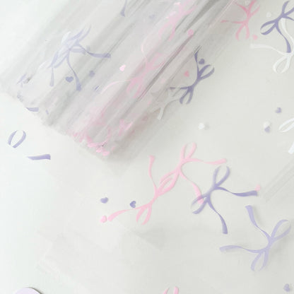20 feuilles de papier cellophane transparent à motif nœuds (57x57cm)